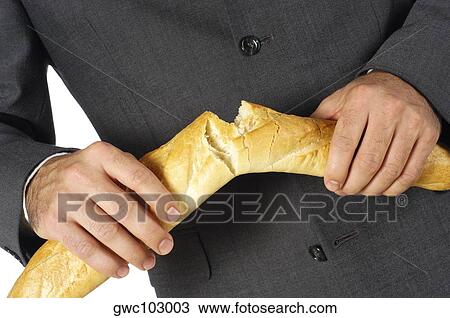 Mid section view of a businessman breaking a loaf of bread View Large Photo Image Stock Image - Mid section view of a businessman breaking a loaf of bread. Fotosearch