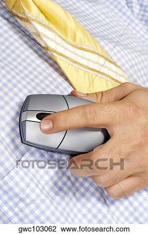 Mid section view of a businessman holding a computer mouse View Large Photo Image Stock Image - Mid section view of a businessman holding a computer mouse. Fotosearch