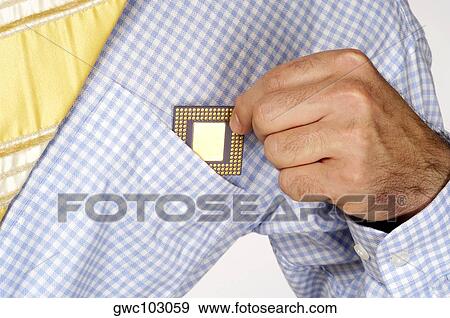 Mid section view of a businessman putting a computer chip into his shirt pocket View Large Photo Image Stock Photo - Mid section view of a businessman putting a computer chip into his shirt pocket. Fotosearch