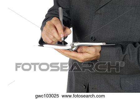 Mid section view of a businessman writing on a spiral notepad View Large Photo Image Stock Photography - Mid section view of a businessman writing on a spiral notepad. Fotosearch