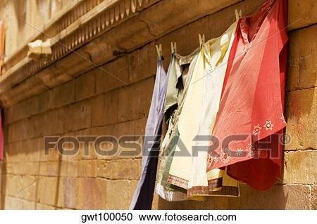 Clothes hanging on a clothesline, Jaisalmer, Rajasthan, India View Large Photo Image Stock Image - Clothes hanging on a clothesline, Jaisalmer, Rajasthan, India. Fotosearch