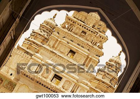Facade of a temple seen through an arch, Pushkar, Rajasthan, India View Large Photo Image Stock Image - Facade of a temple seen through an arch, Pushkar, Rajasthan, India. Fotosearch