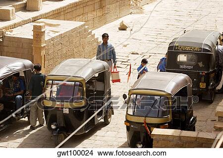 Picture - High angle view of rickshaws on the street, Jaisalmer, Rajasthan, India. Fotosearch