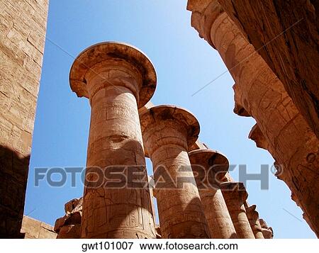 Low angle view of carved columns of a temple, Temples Of Karnak, Luxor, Egypt View Large Photo Image Stock Photo - Low angle view of carved columns of a temple, Temples Of Karnak, Luxor, Egypt. Fotosearch