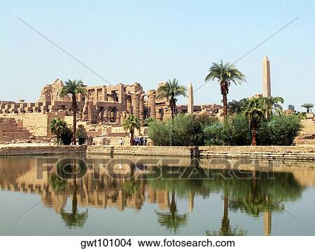 Reflection of trees and temple in water, Temples Of Karnak, Luxor, Egypt View Large Photo Image Picture - Reflection of trees and temple in water, Temples Of Karnak, Luxor, Egypt. Fotosearch