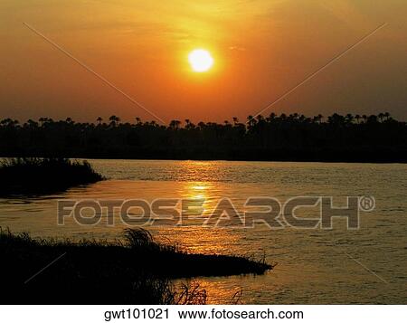 Sunset over a river View Large Photo Image Stock Image - Sunset over a river. Fotosearch