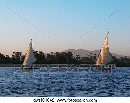 Two sailboats in a river, Nile River, Egypt View Large Photo Image Stock Image - Two sailboats in a river, Nile River, Egypt. Fotosearch