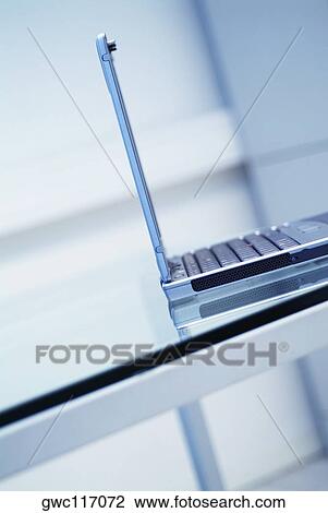 Close-up of a laptop on the table View Large Photo Image Stock Image - Close-up of a laptop on the table. Fotosearch