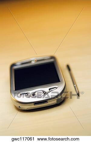 Stock Image - Close-up of a personal data assistant with a stylus. Fotosearch