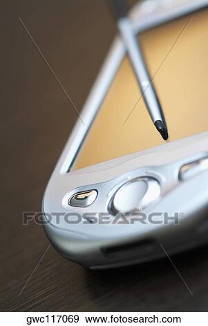 Close-up of a personal data assistant with a stylus View Large Photo Image Stock Photo - Close-up of a personal data assistant with a stylus. Fotosearch
