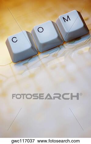 Stock Photo - Close-up of computer keys spelling the word com. Fotosearch