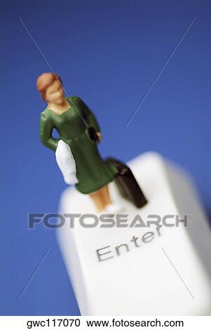 Close-up of the figure of a woman with a briefcase on a computer key View Large Photo Image Stock Image - Close-up of the figure of a woman with a briefcase on a computer key. Fotosearch