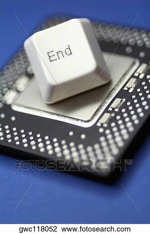 Stock Image - Close-up of a computer key on a computer chip. Fotosearch