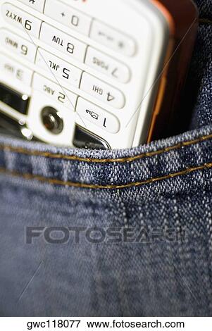 Stock Photo - Close-up of a mobile phone in a pocket. Fotosearch