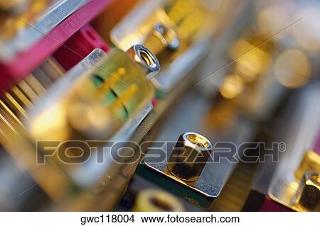 Picture - Close-up of a nut on a circuit board. Fotosearch