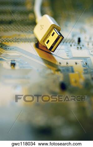 Picture - Close-up of a USB cable on a circuit board. Fotosearch