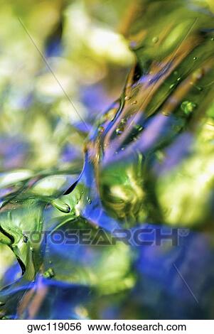 Close-up of ice cubes in water View Large Photo Image Stock Photograph - Close-up of ice cubes in water. Fotosearch