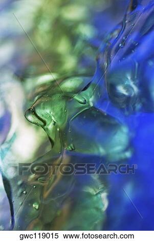 Close-up of ice cubes in water View Large Photo Image Stock Photography - Close-up of ice cubes in water. Fotosearch
