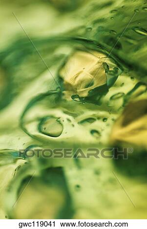 Close-up of water drops on ice cubes View Large Photo Image Stock Image - Close-up of water drops on ice cubes. Fotosearch