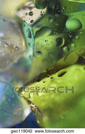 Close-up of water drops on ice cubes View Large Photo Image Stock Image - Close-up of water drops on ice cubes. Fotosearch