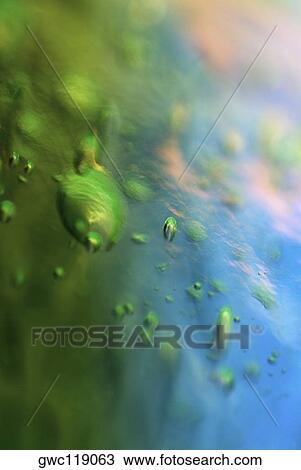 Close-up of water drops on ice cubes View Large Photo Image Stock Image - Close-up of water drops on ice cubes. Fotosearch