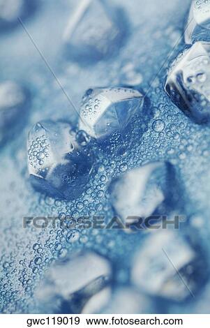 Ice cubes floating on water View Large Photo Image Stock Photo - Ice cubes floating on water. Fotosearch