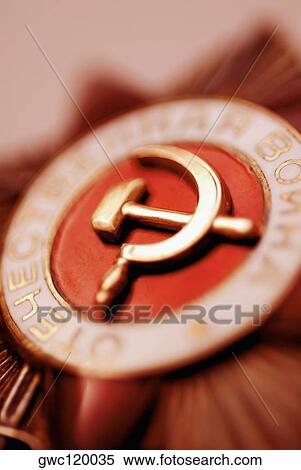 Close-up of a hammer and sickle painted on a badge View Large Photo Image Stock Photography - Close-up of a hammer and sickle painted on a badge. Fotosearch