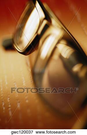 Close-up of a pair of eyeglasses View Large Photo Image Stock Photo - Close-up of a pair of eyeglasses. Fotosearch