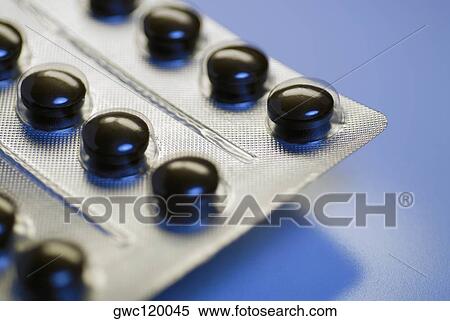 Close-up of pills in a blister pack View Large Photo Image Stock Photography - Close-up of pills in a blister pack. Fotosearch