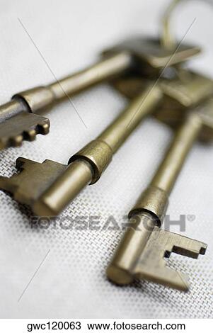Close-up of three keys on a key ring View Large Photo Image Stock Image - Close-up of three keys on a key ring. Fotosearch