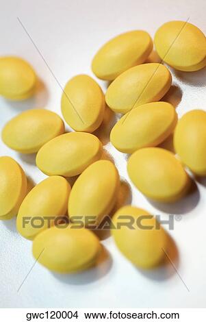 Close-up of yellow pills View Large Photo Image Picture - Close-up of yellow pills. Fotosearch