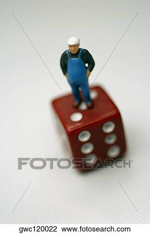 High angle view of a human figurine on a dice View Large Photo Image Stock Image - High angle view of a human figurine on a dice. Fotosearch