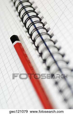 Stock Photo - Close-up of a pencil on an open spiral book. Fotosearch