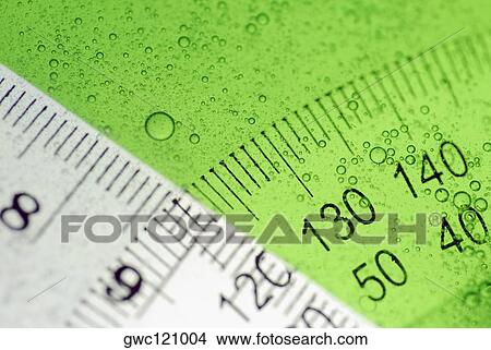 Close-up of a protractor and a ruler in water View Large Photo Image Picture - Close-up of a protractor and a ruler in water. Fotosearch