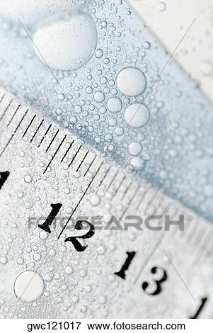 Close-up of a ruler in water View Large Photo Image Stock Photo - Close-up of a ruler in water. Fotosearch
