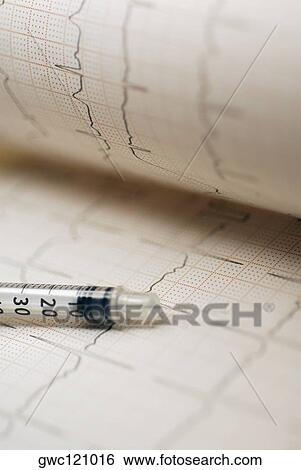 Close-up of an injection on paper View Large Photo Image Stock Photograph - Close-up of an injection on paper. Fotosearch