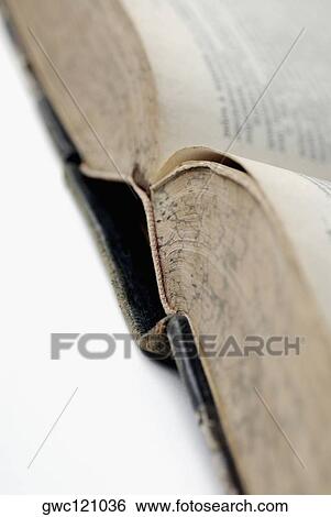 Close-up of an open book View Large Photo Image Stock Photograph - Close-up of an open book. Fotosearch