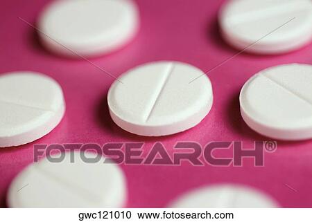 Close-up of white pills View Large Photo Image Stock Image - Close-up of white pills. Fotosearch