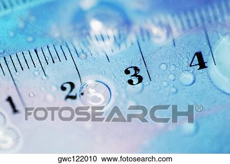 Close-up of a ruler in water View Large Photo Image Stock Image - Close-up of a ruler in water. Fotosearch