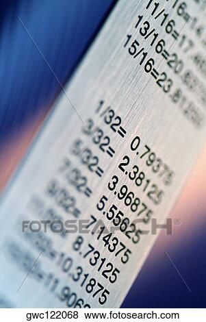 Close-up of a ruler with a conversion table View Large Photo Image Stock Photo - Close-up of a ruler with a conversion table. Fotosearch