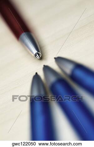 Stock Image - Close-up of four ballpoint pens. Fotosearch
