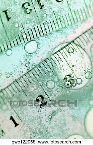 Close-up of rulers in water View Large Photo Image Stock Photo - Close-up of rulers in water. Fotosearch