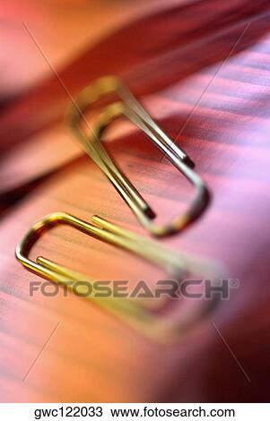 Stock Image - Close-up of two paper clips. Fotosearch