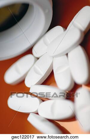 Stock Photo - Close-up of white tablets. Fotosearch