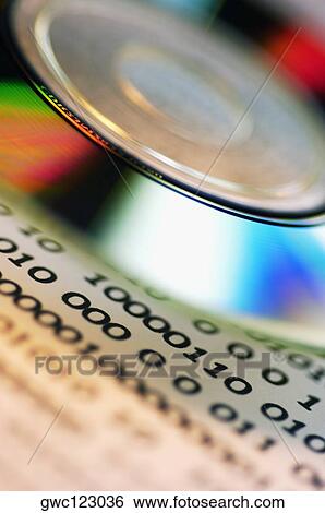 Close-up of a CD and binary code View Large Photo Image Stock Photograph - Close-up of a CD and binary code. Fotosearch