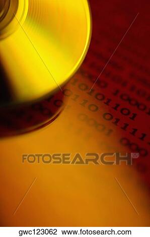 Stock Image - Close-up of a CD on binary code. Fotosearch