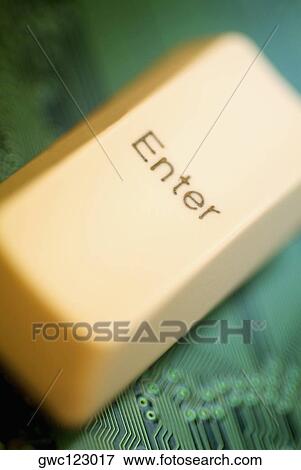 Close-up of a computer key on a circuit board View Large Photo Image Stock Photo - Close-up of a computer key on a circuit board. Fotosearch
