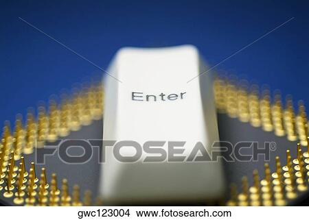 Picture - Close-up of a computer key on a computer chip. Fotosearch