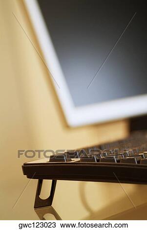 Close-up of a computer keyboard and a computer monitor View Large Photo Image Stock Image - Close-up of a computer keyboard and a computer monitor. Fotosearch