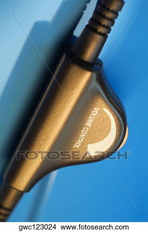 Picture - Close-up of the volume controller on headphones. Fotosearch